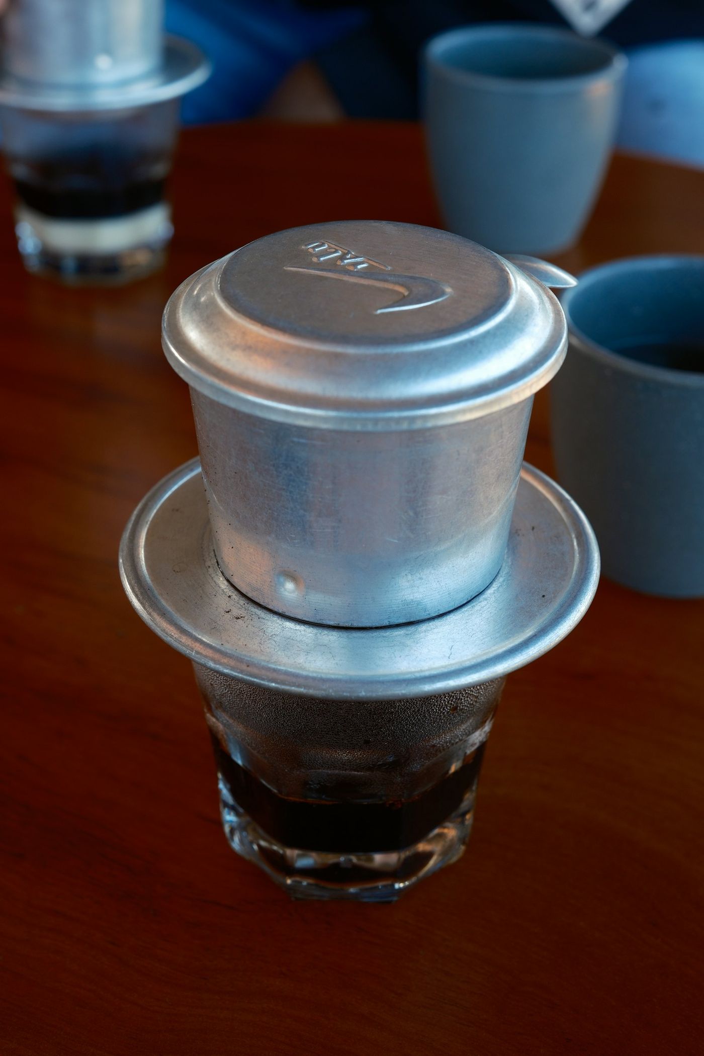 Coffee dripping through a phin filter