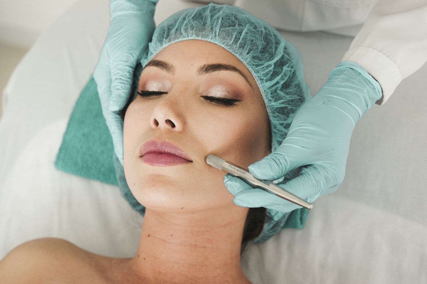 Therapist applying a facial treatment